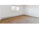 Bright bedroom offers neutral carpet and a window with natural light at 635 S Alton Way # 12C, Denver, CO 80247