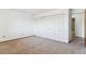 Bedroom with a view of the hallway, featuring closet and neutral carpet at 635 S Alton Way # 12C, Denver, CO 80247