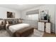 Comfortable bedroom with a large window, neutral colors, and contemporary furnishings at 635 S Alton Way # 12C, Denver, CO 80247
