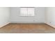 Bedroom featuring tan carpet with a large window at 635 S Alton Way # 12C, Denver, CO 80247