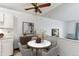 Cozy dining area featuring a modern marble-top table, comfortable seating, and stylish decor at 635 S Alton Way # 12C, Denver, CO 80247