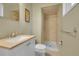 Clean bathroom with shower, toilet, sink, and chrome accessories at 5047 S Mabre Ct, Littleton, CO 80123
