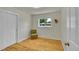 Cozy bedroom features hardwood floors, a neutral color scheme, a closet, and lots of natural light at 5047 S Mabre Ct, Littleton, CO 80123
