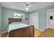 Bright bedroom featuring hardwood floors, closet, and view of the outside at 5047 S Mabre Ct, Littleton, CO 80123