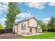 Backyard features a patio, fire pit, lush lawn, shed, and tiered mulch bed at 5262 E Sandpiper Ave, Castle Rock, CO 80104