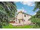 Spacious backyard features a lush lawn, stone patio, and mature trees for outdoor enjoyment at 5262 E Sandpiper Ave, Castle Rock, CO 80104