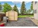 Backyard featuring a storage shed, patio, and well-maintained lawn at 5262 E Sandpiper Ave, Castle Rock, CO 80104