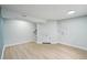 Finished basement with hardwood floors, recessed lighting, and utility access at 5262 E Sandpiper Ave, Castle Rock, CO 80104