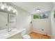 Bathroom with stylish vanity, lighting, and hardwood-style flooring at 5262 E Sandpiper Ave, Castle Rock, CO 80104