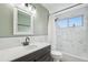 The bathroom is decorated with marble accents and includes a shower and tub at 5262 E Sandpiper Ave, Castle Rock, CO 80104