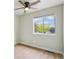 This bedroom features a ceiling fan and a bright window with views at 5262 E Sandpiper Ave, Castle Rock, CO 80104
