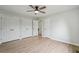 Bedroom with three closets and wood floor at 5262 E Sandpiper Ave, Castle Rock, CO 80104