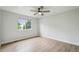 Bedroom featuring hardwood floors, a ceiling fan, and a bright window at 5262 E Sandpiper Ave, Castle Rock, CO 80104