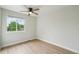 This bedroom features a ceiling fan and a large window at 5262 E Sandpiper Ave, Castle Rock, CO 80104