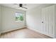 Bedroom featuring wood-look floors, natural light, and closet at 5262 E Sandpiper Ave, Castle Rock, CO 80104