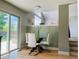 Cozy dining area features a glass-top table, white chairs, and sliding glass door to the backyard at 5262 E Sandpiper Ave, Castle Rock, CO 80104