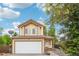 Charming two-story home with a well-maintained lawn, attached garage and beautiful front entrance at 5262 E Sandpiper Ave, Castle Rock, CO 80104
