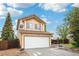 Picture of the front of the two story home with a two car garage and a partial view of the front yard at 5262 E Sandpiper Ave, Castle Rock, CO 80104