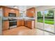 Well-equipped kitchen features modern appliances, ample cabinet space, and sliding door access to the backyard at 5262 E Sandpiper Ave, Castle Rock, CO 80104