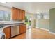 Cozy kitchen showcases wood cabinets, modern appliances, and a sliding glass door that opens to the backyard at 5262 E Sandpiper Ave, Castle Rock, CO 80104