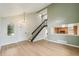 Inviting living room features luxury vinyl flooring, stylish chandelier, and open access to the kitchen at 5262 E Sandpiper Ave, Castle Rock, CO 80104