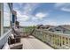 Relaxing back deck featuring a hammock and seating area, ideal for enjoying the outdoors and scenic views at 16978 W 87Th Ave, Arvada, CO 80007