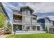 Multi-level deck in backyard showcasing outdoor living space, hot tub, and manicured lawn at 16978 W 87Th Ave, Arvada, CO 80007