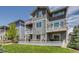 Gorgeous backyard with a large wooden deck, pergola, and a well-maintained lawn at 16978 W 87Th Ave, Arvada, CO 80007
