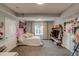 Bedroom with themed decorations, cozy carpet, and natural light from the window at 16978 W 87Th Ave, Arvada, CO 80007