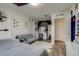 Another angle of the trendy bedroom with eclectic decor, large window, and stylish furnishings at 16978 W 87Th Ave, Arvada, CO 80007