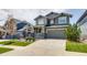 Lovely home with a well-maintained lawn, covered porch, and a two-car attached garage and driveway at 16978 W 87Th Ave, Arvada, CO 80007