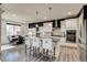 Open kitchen featuring a large island, stainless steel appliances, and adjacent dining area and natural light at 16978 W 87Th Ave, Arvada, CO 80007