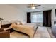 Cozy main bedroom featuring a plush bed, soft lighting, and elegant drapes for a restful atmosphere at 16978 W 87Th Ave, Arvada, CO 80007