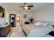 Spacious main bedroom featuring a comfortable bed, stylish decor, and ample natural light for relaxation at 16978 W 87Th Ave, Arvada, CO 80007