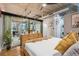 Modern bedroom features hardwood floors, large windows, and natural light at 1720 Wazee St # 2B, Denver, CO 80202
