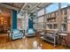 Bright living room features wood floors, large windows, and comfortable seating at 1720 Wazee St # 2B, Denver, CO 80202