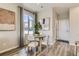 Cozy dining area with round table, natural light, and minimalist decor at 6807 Huddersfield Ln, Castle Pines, CO 80108