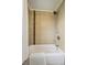 Bathroom with a tub, shower, tile, and chrome fixtures at 1646 S Stuart St, Denver, CO 80219