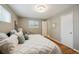 Bedroom featuring a bed, closet, and a window with natural light at 1646 S Stuart St, Denver, CO 80219