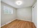 Bedroom with hardwood floors, a window, and a closet at 1646 S Stuart St, Denver, CO 80219
