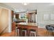 Modern kitchen with granite countertops, stainless steel appliances, and a center island with seating at 1646 S Stuart St, Denver, CO 80219