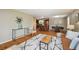 Stylish living room with hardwood floors open to kitchen and modern decor at 1646 S Stuart St, Denver, CO 80219
