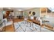 Bright living room featuring hardwood floors, contemporary furnishings, and lots of natural light at 1646 S Stuart St, Denver, CO 80219
