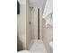 Modern shower featuring decorative tiling, shower head, and fixtures at 1646 S Stuart St, Denver, CO 80219