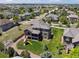 Back of property showing 2-story deck/balcony with playground and large lawn in a lushly landscaped neighborhood at 14022 E Fair Pl, Centennial, CO 80111