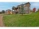 Beautifully landscaped backyard with lush green grass and mature trees at 14022 E Fair Pl, Centennial, CO 80111