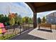 Spacious backyard deck with black railing overlooking the landscaped yard at 14022 E Fair Pl, Centennial, CO 80111