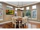 Dining room with a large table and chairs with many windows at 14022 E Fair Pl, Centennial, CO 80111