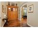 Elegant foyer features hardwood floors, decorative front door, and access to office at 14022 E Fair Pl, Centennial, CO 80111