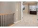Hallway leads to a bedroom with large windows and bright, neutral tones at 14022 E Fair Pl, Centennial, CO 80111